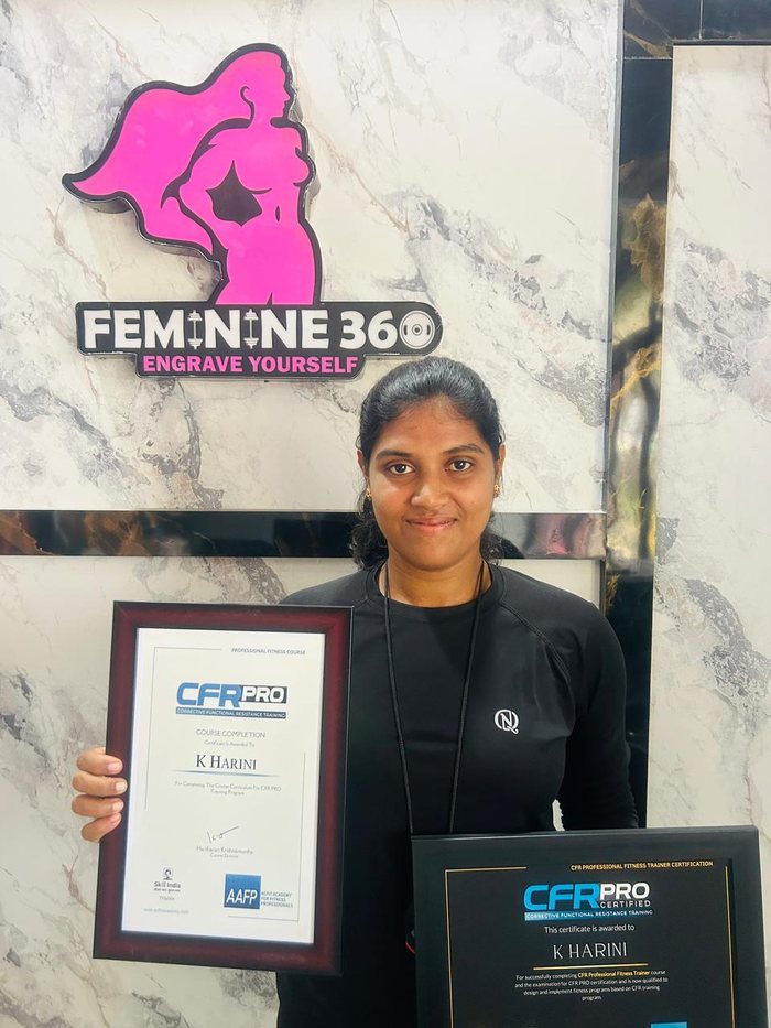 Harini, Head Trainer at Feminine 360, holding her CFR PRO certification